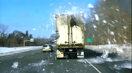 Truck driving dangerously with snow on roof
